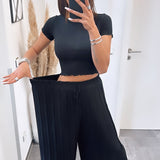 Maia - Crne plisirane pantalone