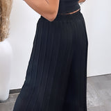 Maia - Crne plisirane pantalone